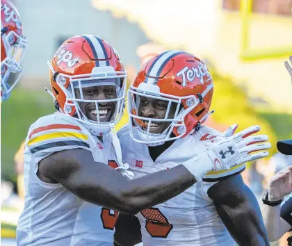  ?? KEVIN RICHARDSON/BALTIMORE SUN PHOTOS ?? Maryland wide receiver Rakim Jarrett, right, celebrates with teammate Chigoziem Okonkwo after scoring a touchdown in the fourth quarter on Saturday in College Park.