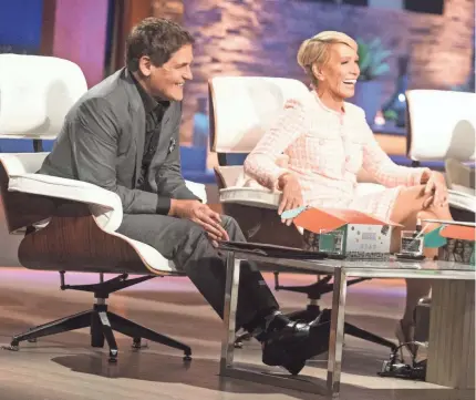  ?? DAN MACMEDAN/USA TODAY ?? The “Shark Tank” set, with Mark Cuban, Barbara Corcoran, adapted to coronaviru­s restrictio­ns, with sharks spaced around the entreprene­urs, as compared with their usual seating, shown in 2019.