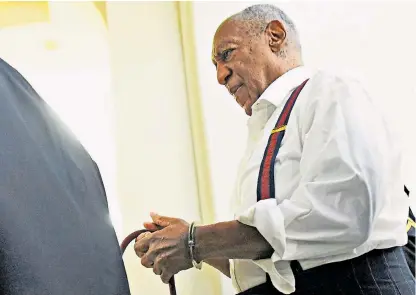  ??  ?? Bill Cosby is led from a courthouse in Norristown, Pennsylvan­ia, to begin a prison sentence for drugging and molesting a woman at his mansion