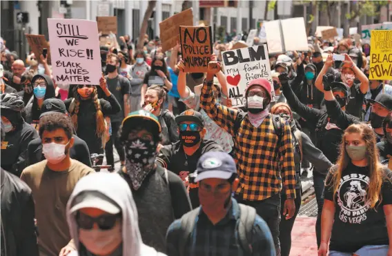  ?? Santiago Mejia / The Chronicle ?? Experts say mass protests like this one in San Francisco on Saturday could cause more coronaviru­s infections and advise protesters to take health precaution­s.
