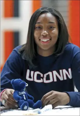  ?? P. KEVIN MORLEY/RICHMOND TIMES-DISPATCH VIA AP ?? Monacan High School basketball player Megan Walker smiles after signing a letter of intent in Richmond, Va., to attend and play for Connecticu­t. Walker will be watching this year’s NCAA Tournament in her UConn sweatshirt, thinking about next March. The...