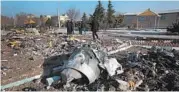  ?? GETTY-AFP ?? Recovery teams work amid debris after a Ukrainian plane carrying 176 people was shot down last week in Iran.