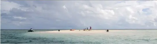  ?? MAGENTA HYDE/FOR THE WASHINGTON POST ?? Guests of the Mandala Island Resort in the Kingdom of Tonga visit a nearby sand cay, which appears only at low tide.