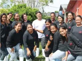  ??  ?? Myles Guillermo (center) together with the employees of EJG Mighty Duck Farm, Inc.