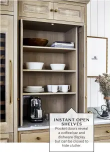  ?? ?? INSTANT OPEN SHELVES
Pocket doors reveal a coffee bar and dishware display but can be closed to hide clutter.