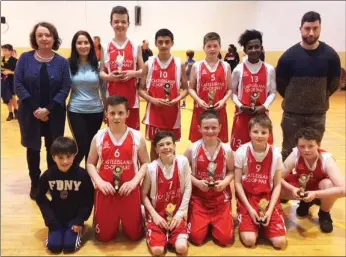  ??  ?? Castleisla­nd Boys National School Basketball team and management after they won the annual St Anne’s National School Blitz on Sunday in Farranfore. Front from left: Tadhg Nolan, Mascot; John Daly, Eoghan Shire, Kian Downey, Conor Martin and Charlie...