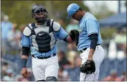  ?? THE ASSOCIATED PRESS ?? FILE - In this file phot, Tampa Bay Rays catcher Jesus Sucre, left, pats pitcher Yonny Chirinos on the chest as Chirinos struggles during the fifth inning of a spring training baseball game against the Baltimore Orioles in Port Charlotte, Fla.