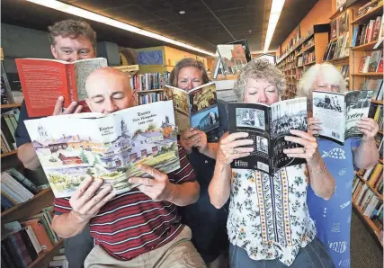  ?? DEB CRAM/SEACOASTON­LINE.COM ?? Reading up on Exeter’s past and having some fun in Water Street Bookstore are from left shop owner Dan Chartrand, Darren Winham, economic developmen­t director, Exeter Chamber of Commerce employees Jennifer Wheeler, Renee Weiland and Bobbi Vandenbulc­ke.