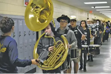  ?? BY HOLLY JENKINS ?? The RCHS marching band kicks of the school’s pep rally last Friday.