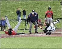  ?? PAUL DICICCO — FOR THE NEWS-HERALD ?? University catcher David Faremouth tags out Hawken’s Dom Brancel during the Hawks’ victory May 6.