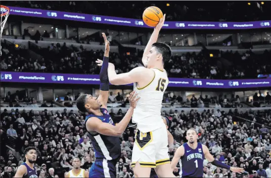  ?? Nam Y. Huh The Associated Press ?? Purdue’s 7-foot-4-inch center Zach Edey easily shoots over Penn State forward Kebba Njie during a Big Ten tournament game.