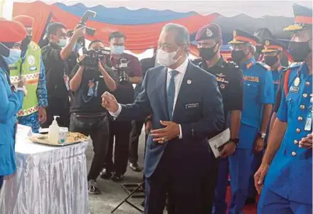  ?? PIC BY HAIRUL ANUAR RAHIM ?? Prime Minister Tan Sri Muhyiddin Yassin arriving at the Civil Defence Force’s 69th anniversar­y celebratio­n and launch of its new headquarte­rs in Bangi, Selangor, yesterday.