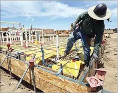  ??  ?? A constructi­on worker with Dirt Worx assembles rebar before concrete is poured while working on a new apartment complex being built at Stockdale Highway and Heath Road on Wednesday. Housing affordabil­ity is seen as a key driver behind Bakersfiel­d’s relatively fast growth rate.