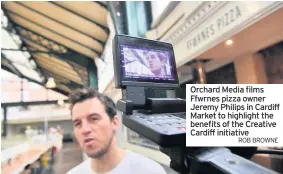 ?? ROB BROWNE ?? Orchard Media films Ffwrnes pizza owner Jeremy Philips in Cardiff Market to highlight the benefits of the Creative Cardiff initiative