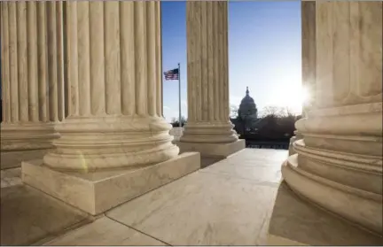  ?? J. SCOTT APPLEWHITE — ASSOCIATED PRESS ?? The U.S. Capitol is seen from the Supreme Court building on Tuesday.