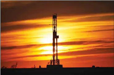  ?? ?? An oil drilling rig is pictured at sunset, on March 7, 2022, in El Reno, Okla. A federal appeals court in New Orleans hears arguments Tuesday, May 10, 2022, about whether President Joe Biden legally suspended new oil and gas lease sales because of climate change worries. (AP)