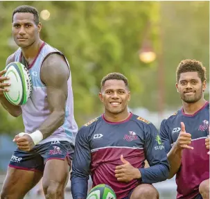  ?? Photo: Reds, ?? From left: Suliasi Vunivalu, Filipo Daugunu, Ilaisa Droasese of the Queensland Reds.