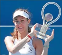  ?? AP ?? Mihaela Buzarnescu holds up the winner’s trophy after defeating Maria Sakkari in the final. —