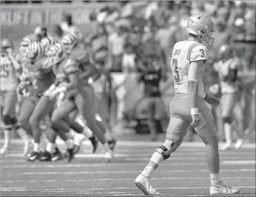  ?? Photograph­s by Mark Humphrey Associated Press ?? UCLA QUARTERBAC­K Josh Rosen leaves the field after one of Memphis’ two second-half intercepti­ons.