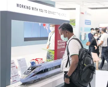  ?? ?? A visitor examines a model train at Asia Pacific Rail 2022. The 2023 edition of the rail industry event takes place on Wednesday and Thursday at Bitec.