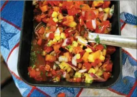  ?? PHOTO BY EMILY RYAN ?? For a twist on tradition, try this fresh tomato and pineapple salsa from Weaver’s Orchard.