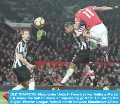  ??  ?? OLD TRAFFORD: Manchester United’s French striker Anthony Martial (R) heads the ball to score an equalising goal for 1-1 during the English Premier League football match between Manchester United and Newcastle at Old Trafford in Manchester. — AFP