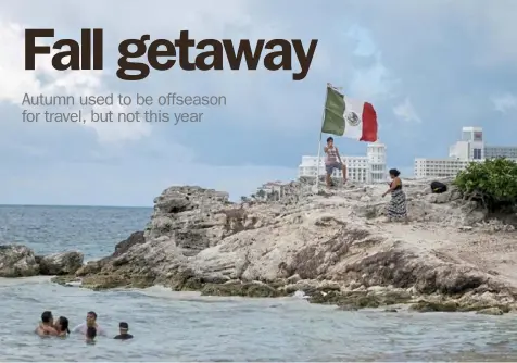  ?? Victor Ruiz/ Associated Press ?? People spend time on the coast of Cancun, Mexico, in June. Cancun has become a popular choice for fall travelers this year.