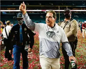  ?? Lynne Sladky / AP ?? Alabama head coach Nick Saban leaves the field after winning against Ohio State in the CFP national championsh­ip game in Miami Gardens, Fla., in 2021.