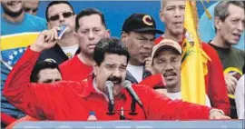  ?? Federico Parra AFP/Getty Images ?? MADURO has given no indication that he will call off the election of assembly members charged with rewriting the constituti­on, despite global condemnati­on.