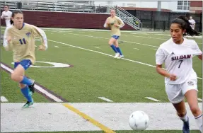  ?? Graham Thomas/Siloam Sunday ?? Siloam Springs senior Laura Morales turns up field with the ball as Harrison junior Kaitlyn Pratt gives chase during the first half of Tuesday’s 5A/6A District 1 girls soccer match at Panther Stadium. Siloam Springs defeated Harrison 3-1.