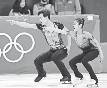  ??  ?? Ryom Tae-Ok and Kim Ju Sik of North Korea wowed the crowd with their performanc­e. ROBERT DEUTSCH/ USA TODAY SPORTS
