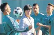  ?? AFP ?? ■ Germany coach Joachim Loew (centre) speaks with his players ahead of their opening match in Vatutinki, near Moscow.