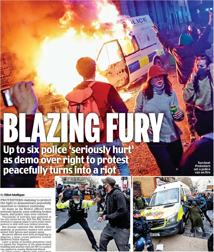  ??  ?? Torched: Protesters set a police van on fire
Clash: An officer armed with a baton wards off a protester. Right, a group attempts to topple a van covered in graffiti