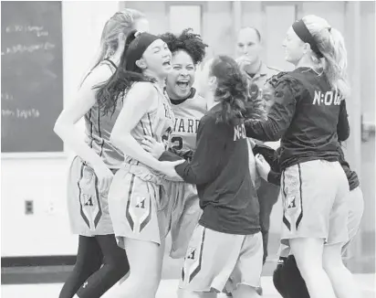  ?? BRIAN KRISTA/BALTIMORE SUN MEDIA GROUP ?? Howard players celebrate their win over Long Reach on Tuesday that helped move them into a tie for first place in Howard County.