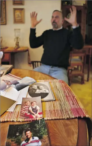  ?? BENJAMIN BENSCHNEID­ER/ SEATTLE TIMES ?? Wally Somers set out to climb Sloan Peak in Washington state nearly 40 years ago and never returned. His family still struggles to fill the void. His younger brother, Ed Somers, sorts through family memorabili­a, including pictures of Wally ( bottom)...