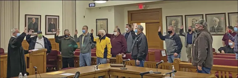  ?? Special to the MDR ?? On Jan. 1 as members of the Hot Spring County Quorum Court being a new term they are sworn in by Circuit Judge Chris Williams at the Hot Spring County Courthouse. JP Mike Fletcher was sworn in virtually through Zoom.