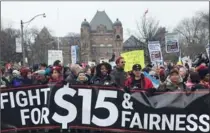  ?? TORONTO STAR FILE PHOTO ?? People supporting the $15 minimum wage demonstrat­e at Queen’s Park in January. The province has been warned the wage hike will lead to job losses.