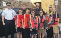  ??  ?? St-Edmund Elementary School students helped police officers warn speeding drivers to slow down in school zones last fall. This year, Station 1 will again set up radar traps at an elementary school located on a major artery and hand out warnings instead...