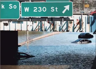  ?? Spencer Platt / Getty Images ?? Cars sit abandoned on the flooded Major Deegan Expressway following a night of extremely heavy rain from the remnants of Hurricane Ida on Thursday in the Bronx borough of New York City. Multiple fatalities have been reported in the region after the storm passed through, causing massive flooding and a widespread disruption of subway service. A tornado touched down in Pennsylvan­ia resulting in extensive property damage.