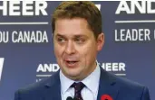  ?? JACK BOLAND / POSTMEDIA NEWS ?? Tory Leader Andrew Scheer asked Tony Clement to leave caucus because of online allegation­s of creepy behaviour.