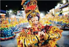  ?? AFP ?? Members of Vila Isabel samba school perform during the second night of Rio’s Carnival parade on Sunday.