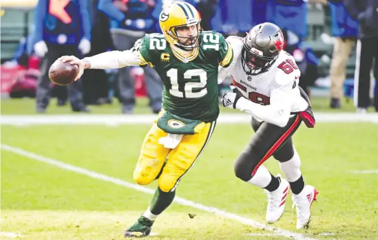  ?? BENNY SIEU / USA TODAY SPORTS ?? Packers quarterbac­k Aaron Rodgers was down in the dumps following the loss to Jason Pierre-Paul and the Buccaneers in the NFC Championsh­ip on Sunday.