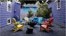  ?? BETH NAKAMURA / FOR THE WASHINGTON POST ?? The space between this Portland, Oregon, home and a rental cottage the owners built serves as a patio with separate seating areas and a firepit.