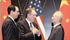  ?? NG HAN GUAN/AP ?? U.S. Trade Representa­tive Robert Lighthizer, left, chats with Vice Premier Liu He at a July conference in Shanghai.