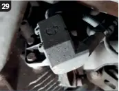  ??  ?? 29
The gearbox will have lowered sufficient­ly for the next phase of work to begin. Return to the cover hiding the connector attaching the wiring loom to the side of the gearbox. Undo the two 10mm bolts.