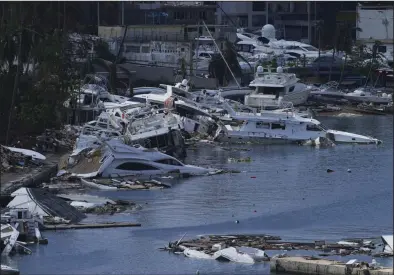 ?? (AP/Marco Ugarte) ?? Yachts damaged and destroyed by Hurricane Otis fill a harbor in Acapulco, Mexico, earlier this month.