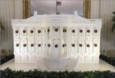  ?? CAROLYN KASTER — THE ASSOCIATED PRESS ?? The gingerbrea­d White House is seen in the East Dining Room during a media preview of the 2017 holiday decoration­s at the White House in Washington, Monday.