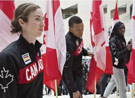  ?? JASON FRANSON/THE CANADIAN PRESS ?? Canada has high expectatio­ns in Rio for its track and field team which includes, from left, Nicole Sifuentes, Andre De Grasse and Christabel Nettey.