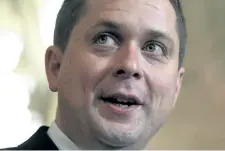  ?? JUSTIN TANG/THE CANADIAN PRESS ?? Conservati­ve Party leader Andrew Scheer speaks to reporters during an end of session media availabili­ty on Parliament Hill in Ottawa in June. Scheer isn’t saying whether he’ll condemn online news outlet the Rebel for its coverage of last weekend’s...