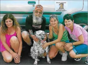  ?? LORETTA RODGERS — DIGITAL FIRST MEDIA ?? Jill Speckman and Kim Mazzenga of Delco Dawgs with Charlie, an injured pit bull they rescued off the streets of Chester. Charlie was wandering, covered with scars and he had a huge tumor hanging from his neck.